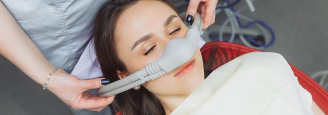 patient with inhalation mask for dental sedation